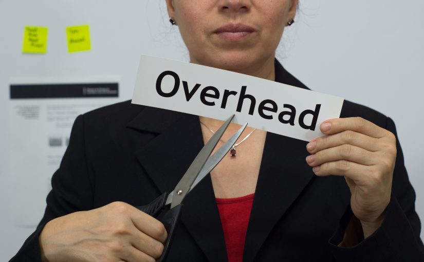 Businesswoman Cuts Overhead Concept