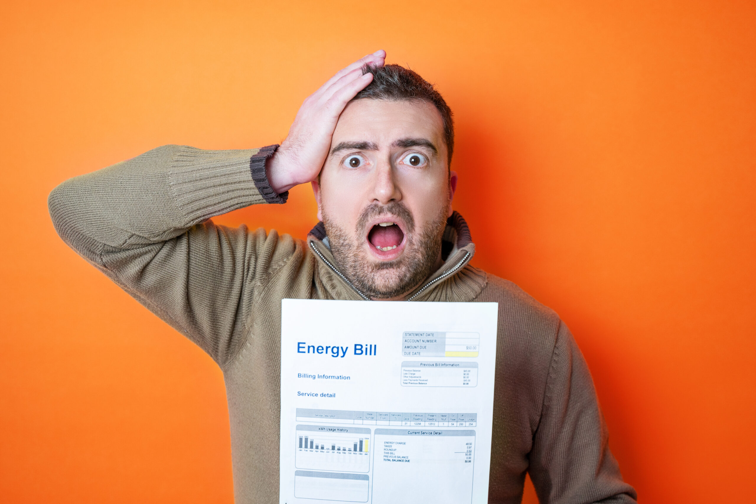 One man worried about bills reading energy increase costs isolat