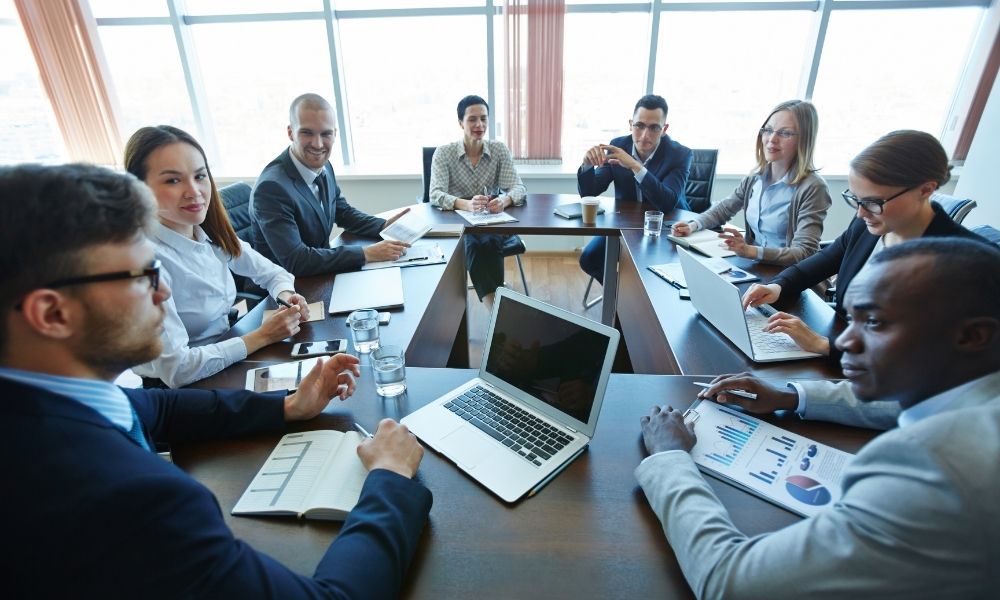 A business meeting with participants following good meeting etiquette.
