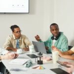 A man chairing a meeting to ensure objectives are being met.