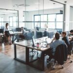 A coworking office space with teams collaborating on projects.