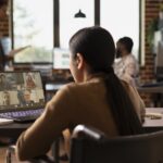 A female manager making use of a flexible workspace as part of the company’s hybrid working model.