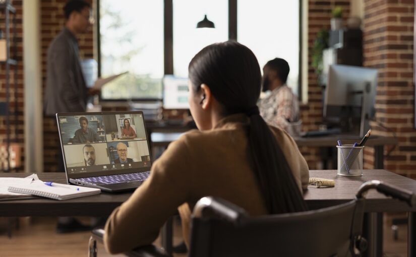 A female manager making use of a flexible workspace as part of the company’s hybrid working model.
