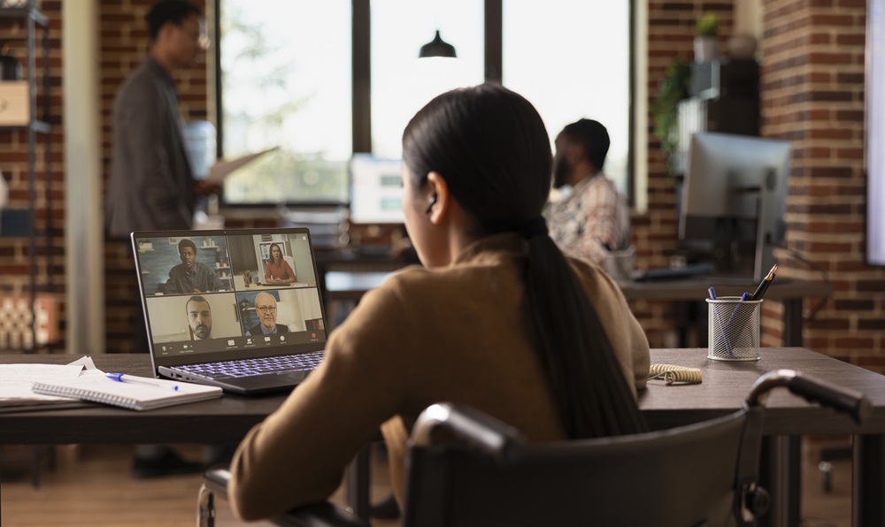 A female manager making use of a flexible workspace as part of the company’s hybrid working model.