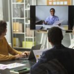 A team having a virtual meeting in a hybrid office space.